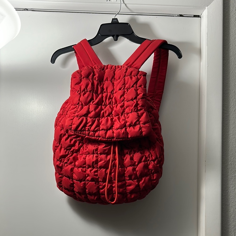 Red spacious Quilted Backpack.  I have several in the red many in cream colored